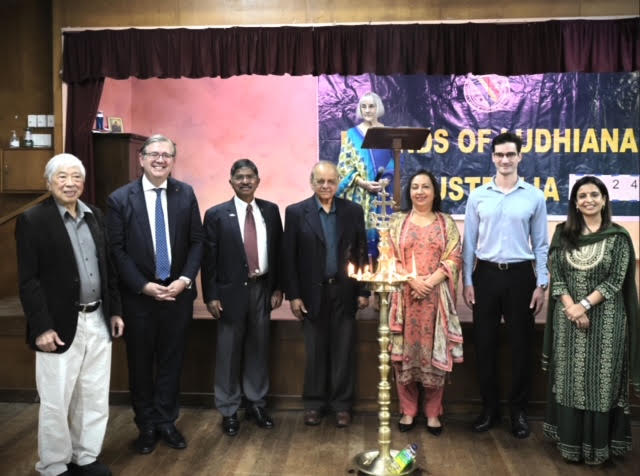 Group photograph in front of the Friends of Ludhiana Australia banner