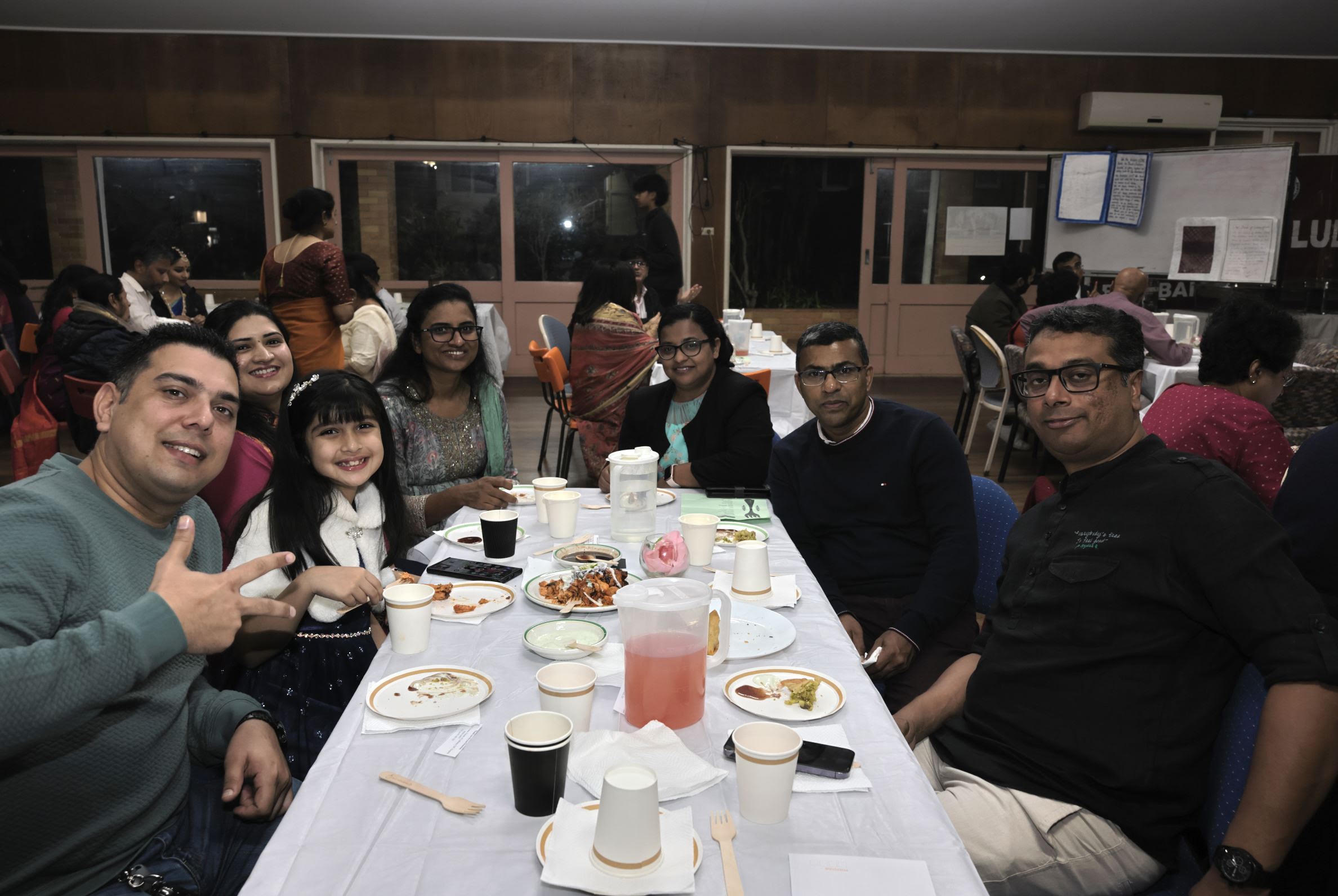 Families sharing a meal at the gathering