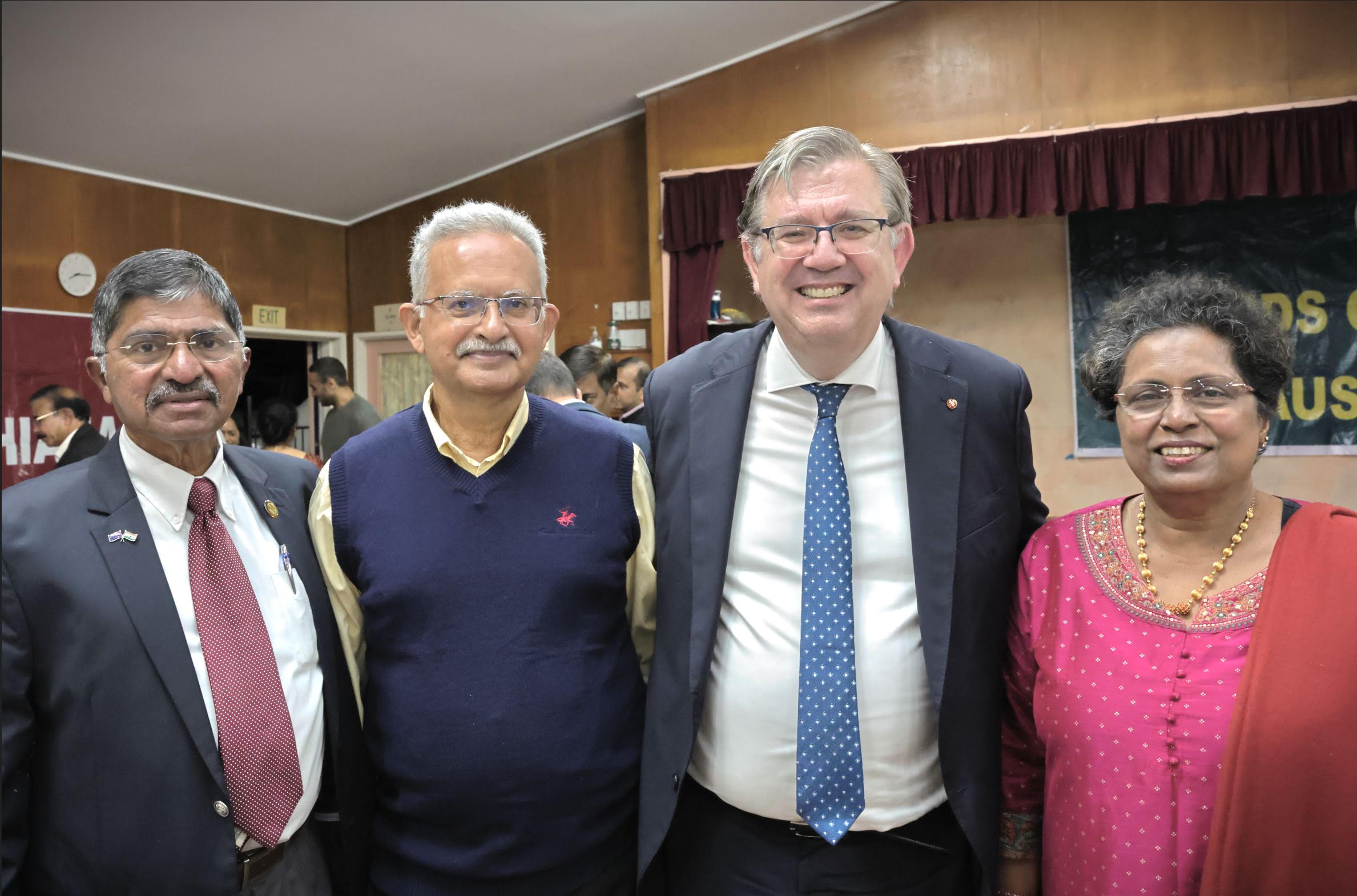 Trustees standing with the guest speaker
