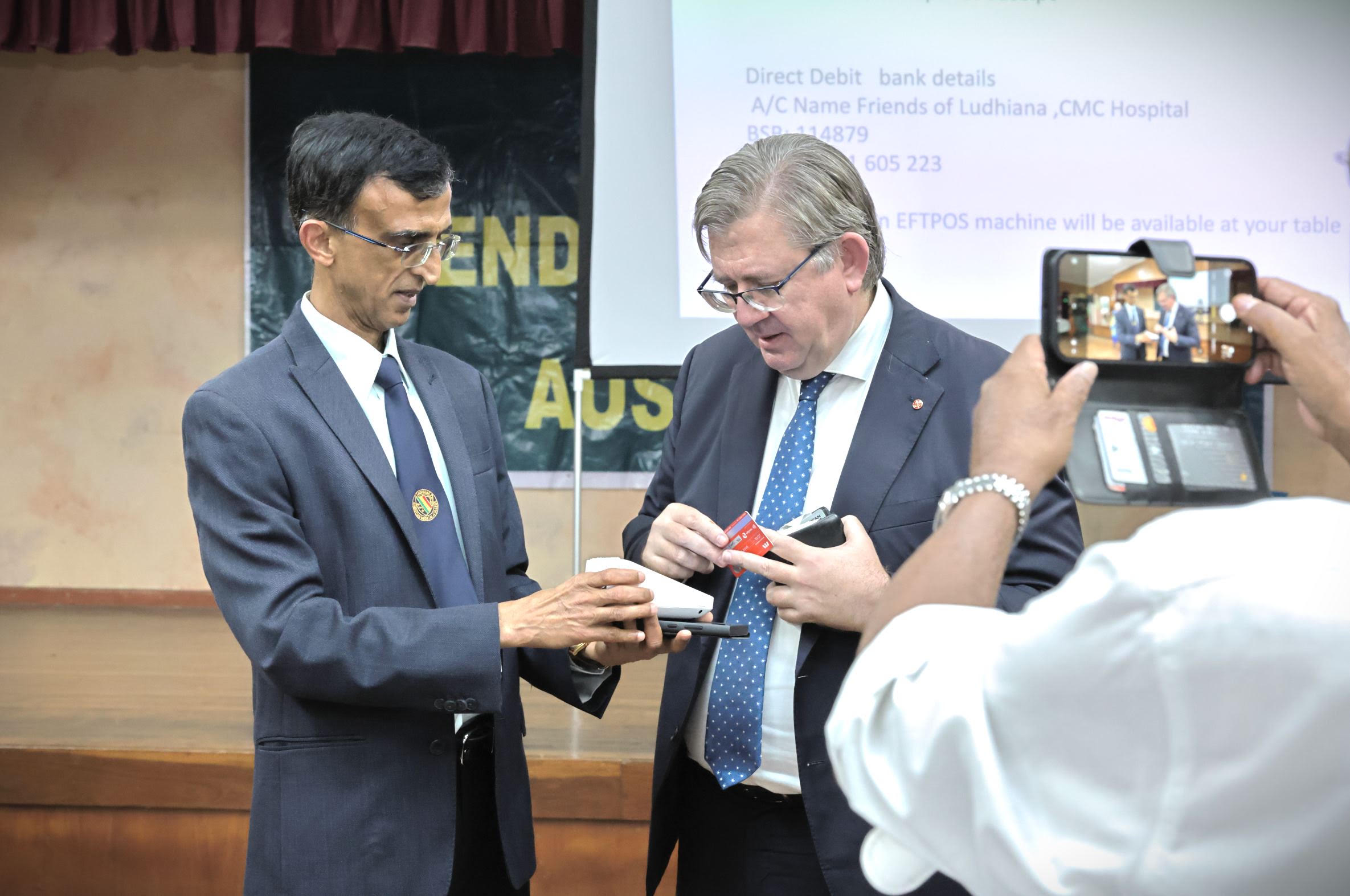 Donations being taken by card at the fundraising dinner