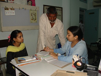 A young girl with her family at the poor patients' clinic at CMC Ludhiana